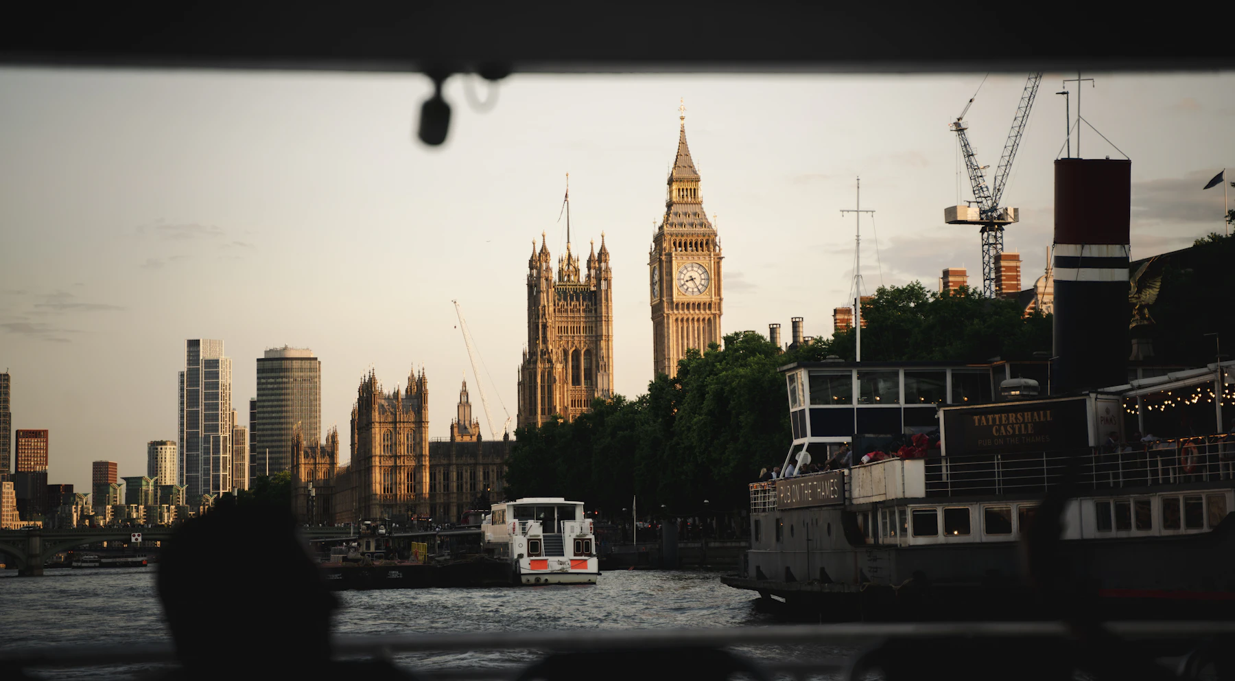 The River Thames and Westminster in London at dusk.